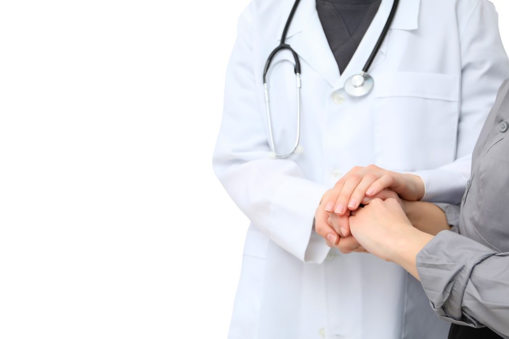 Healthcare professionals engage in supportive interaction today, isolated on white